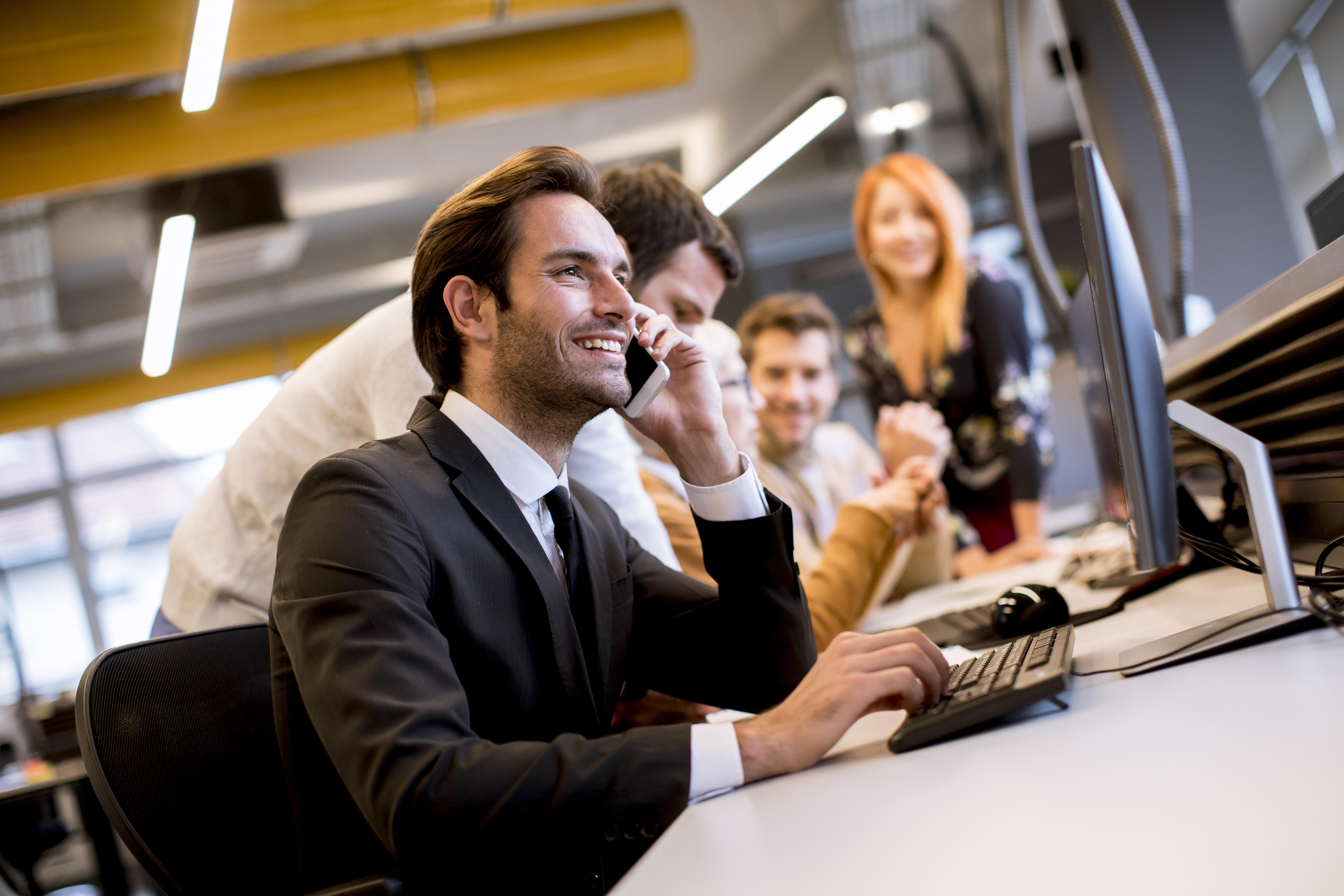 The Your Communications team working together in their Lincoln office